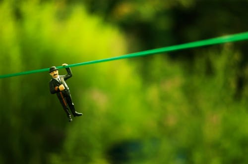 Free Close-up of a Little Figurine of Charlie Chaplin Hanging on a String  Stock Photo