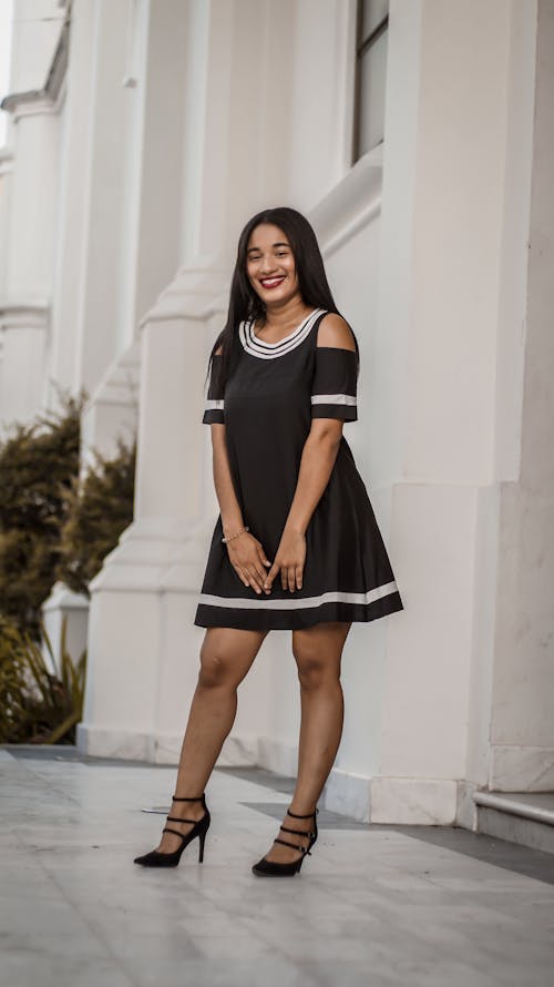 A Beautiful Woman in Black Dress Smiling