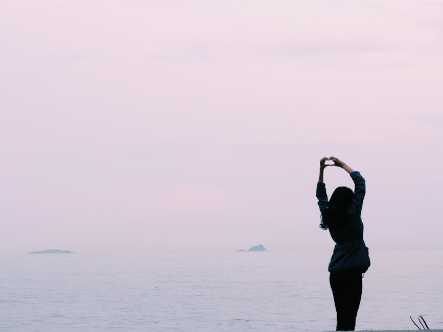 Woman Standing Near Body of Water