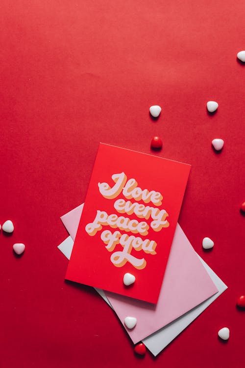 Love Card with Heart Shape Materials on Red Surface