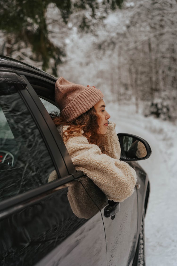 Person With Beanie In A Car