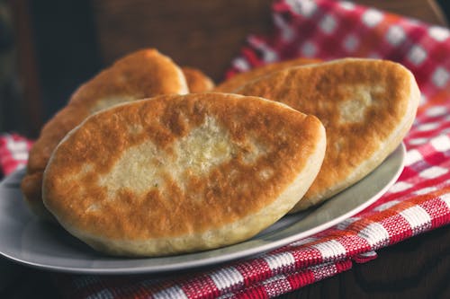 A Freshly Baked Breads on a Ceramic Plate