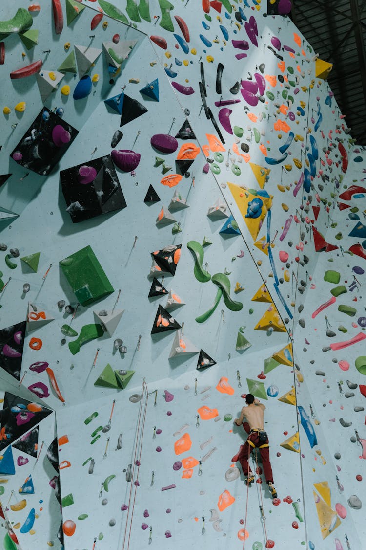 Man Climbing Bouldering Wall Indoors