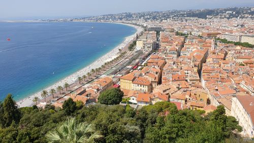 A stunning aerial view of Nice's coastline featuring the Promenade des Anglais and the Mediterranean Sea.