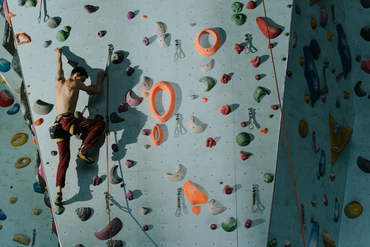 Shirtless Man Bouldering