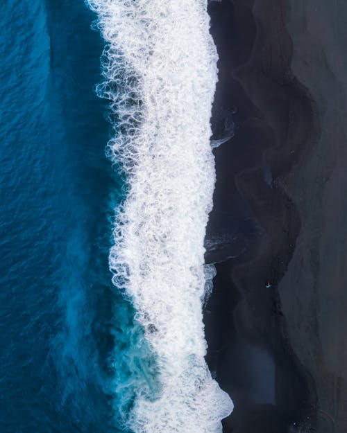 Foamy sea splashing on coast