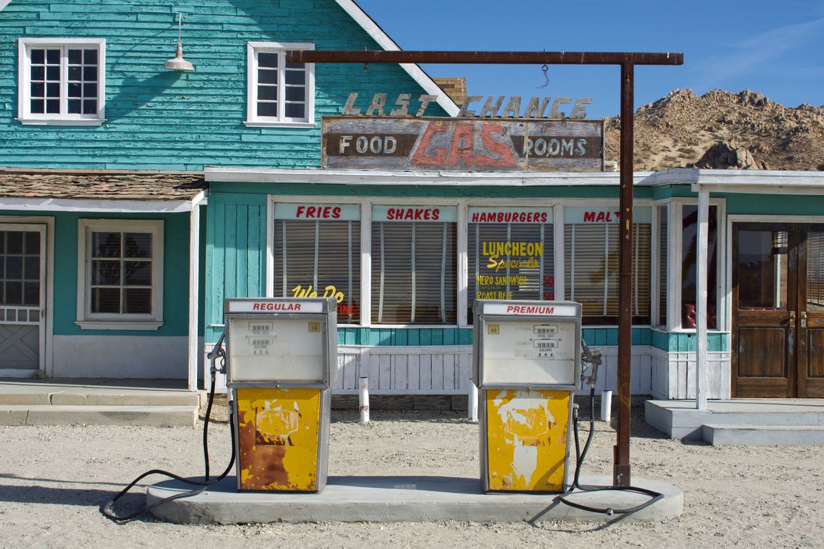 Historic roadside service station with retro gasoline pumps