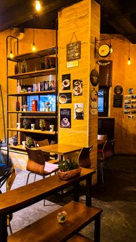 Inviting café interior with warm lighting, wooden furniture, and coffee-themed decor.