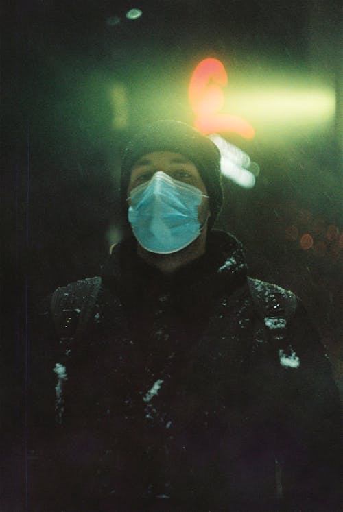 Man in Black Hoodie Wearing Face Mask