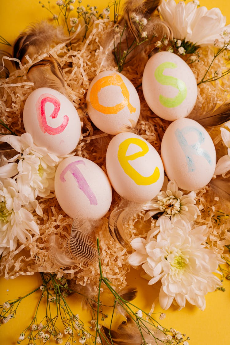 Painted Eggs On The Flowers