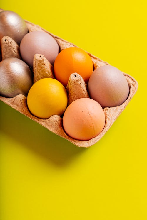 Close-Up Shot of Colorful Easter Eggs in an Egg Tray