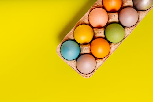 Close Up Photo of Easter Eggs on Egg Carton