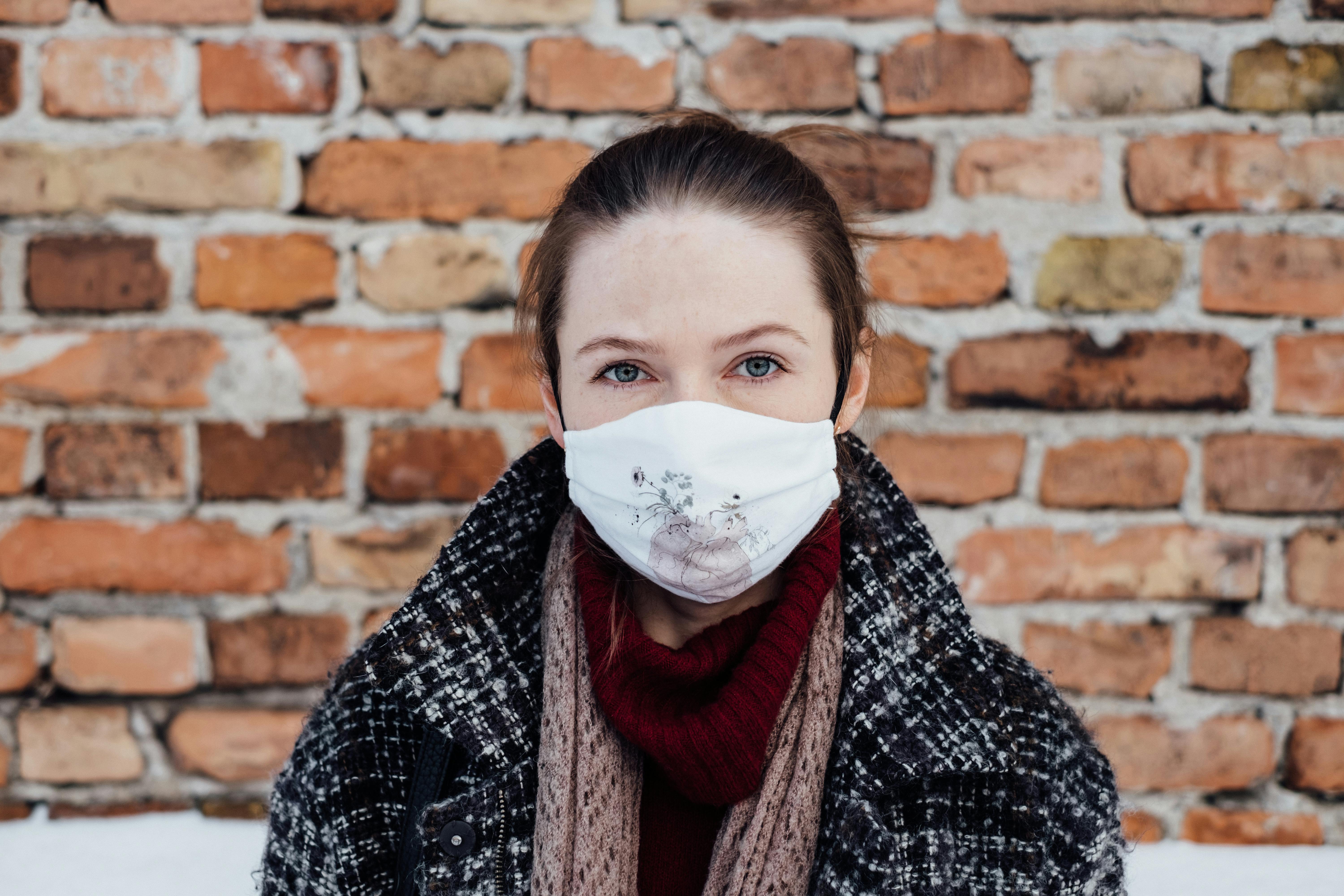A Woman in Plaid Jacket Wearing a Face Mask · Free Stock Photo