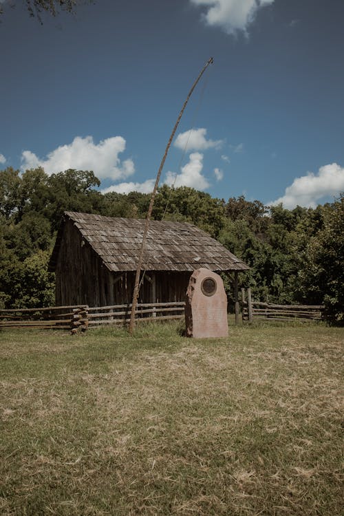 Wooden House on the Green Grass Field