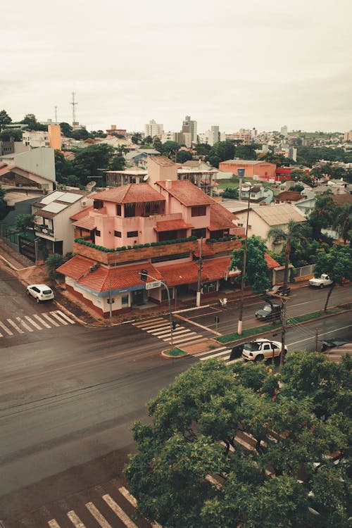 Overcast sky over town with small residential houses and asphalt roads