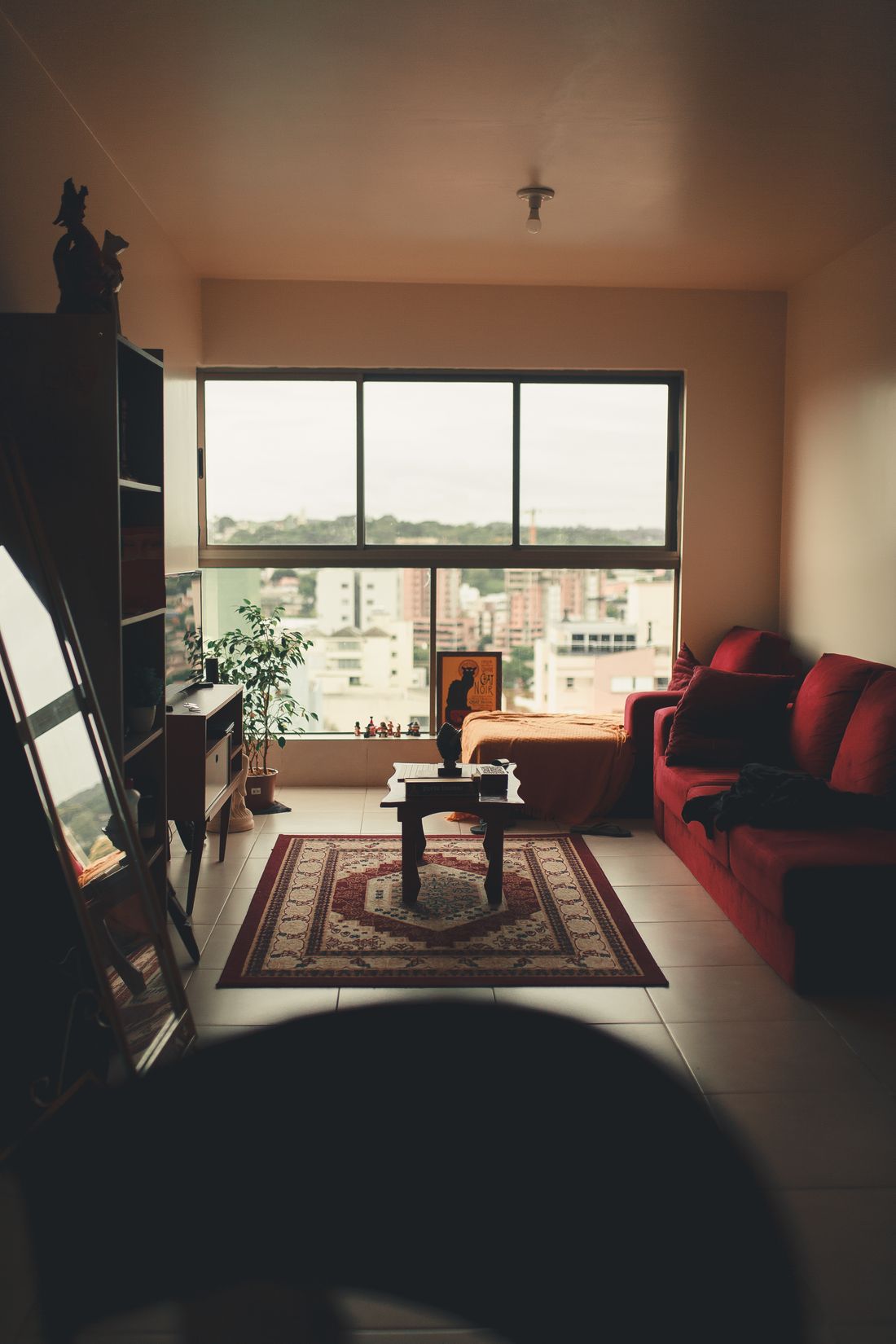 Modern apartment interior with a large fixed picture window