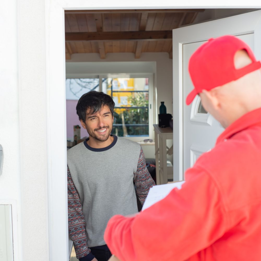 Kirkham — movers delivering furniture from a van
