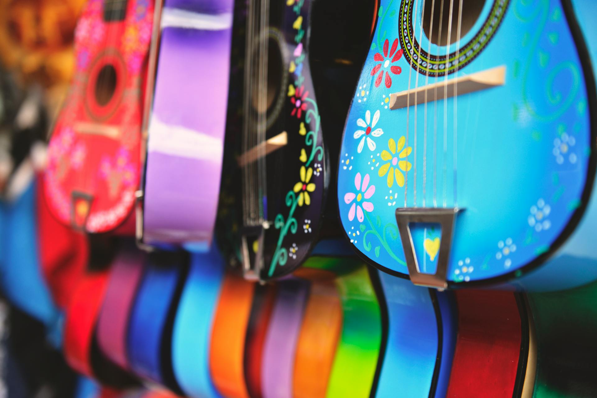 Blue, Purple and Green Acoustic Guitars