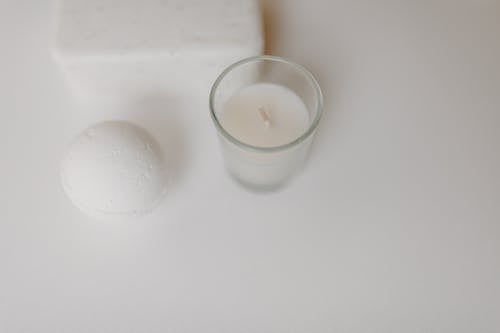 Free 

A Close-Up Shot of a Bath Bomb and a Candle Stock Photo