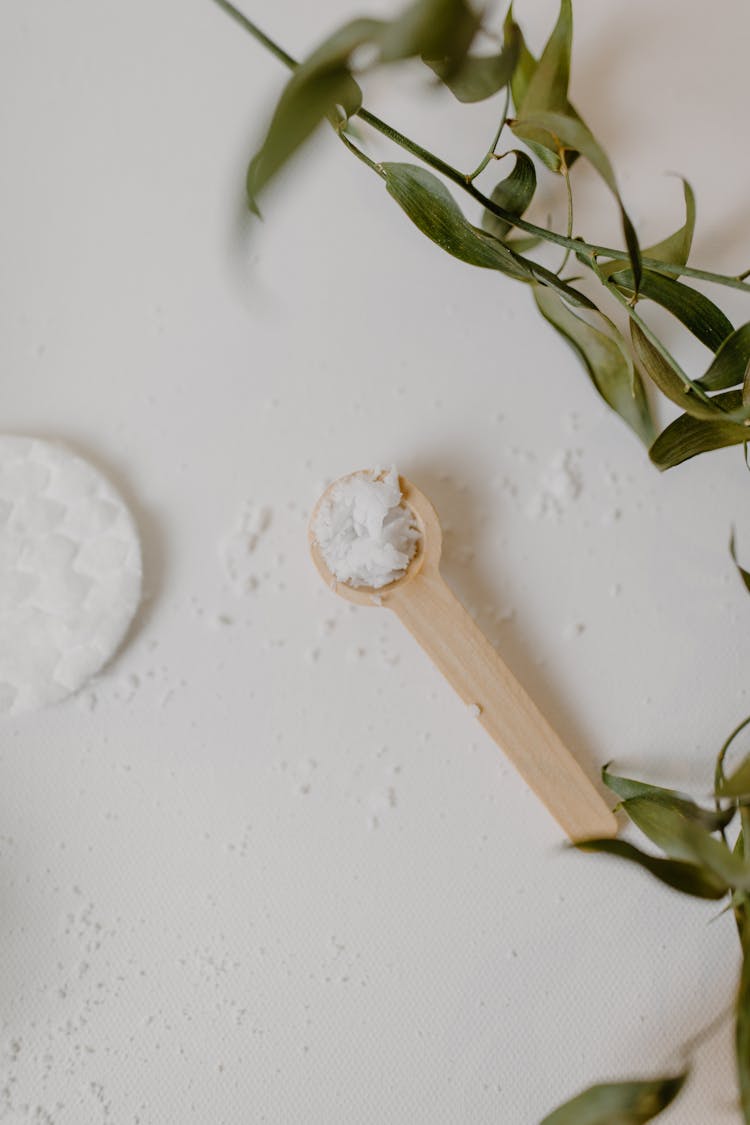 Coconut Shavings On A Wooden Spoon