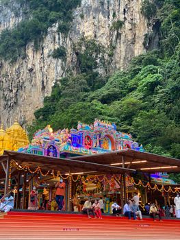 Colorful temple entrance at Batu Caves, a popular tourist attraction in Malaysia.