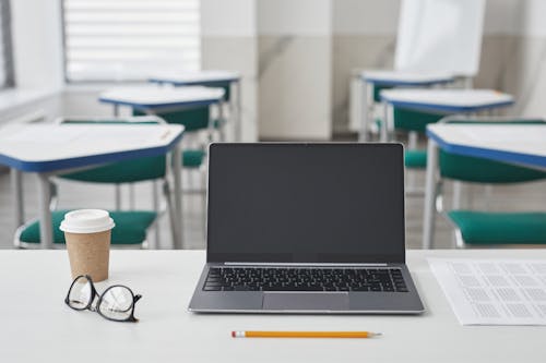 Free A Laptop with Coffee on the Side Stock Photo