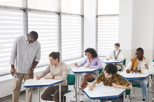 A Man Looking at His Students while Taking Exam