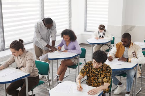 A High Angle Shot of Students Taking Exam Inside the Classroom