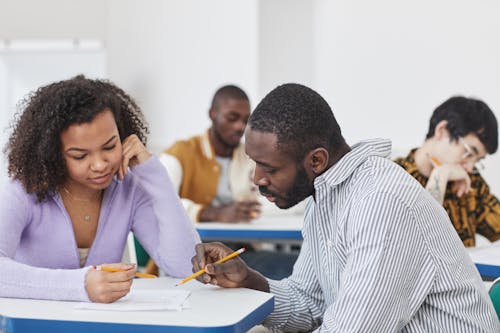 Free Student and Teacher Having a Conversation Stock Photo