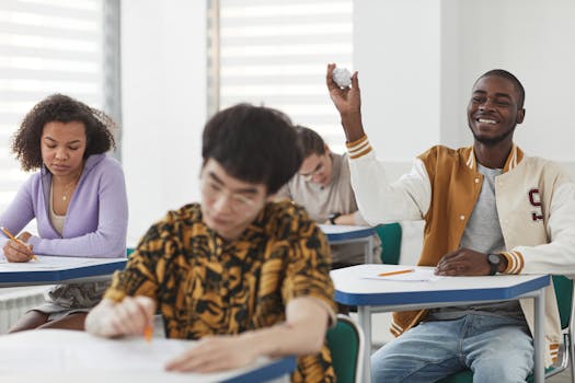 Students taking an exam in a diverse classroom, showing a mix of focus and playful interactions.