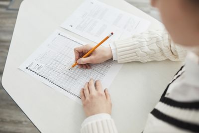 Student writing during a practice test
