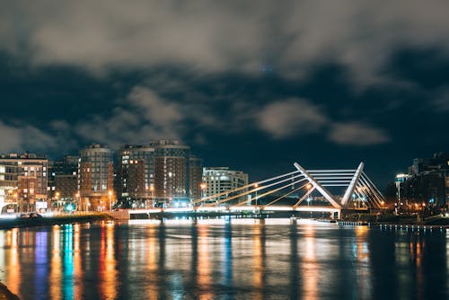 Free City Buildings and Bridge at Night Stock Photo