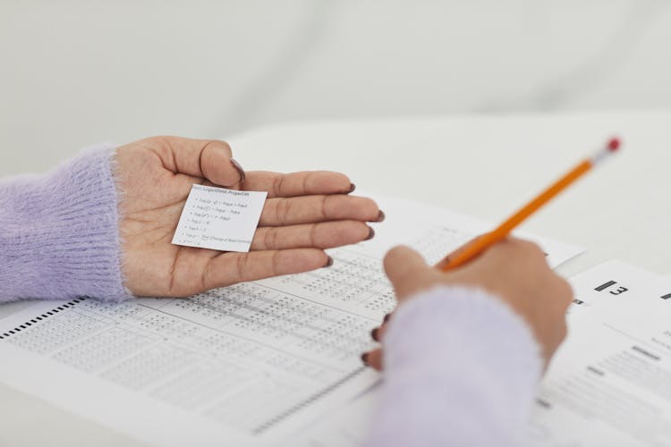 A Person Cheating In An Exam