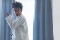 A Boy Face of Intensity in Training Karate