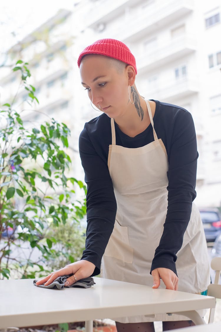 Photo Of Person Wiping The Table