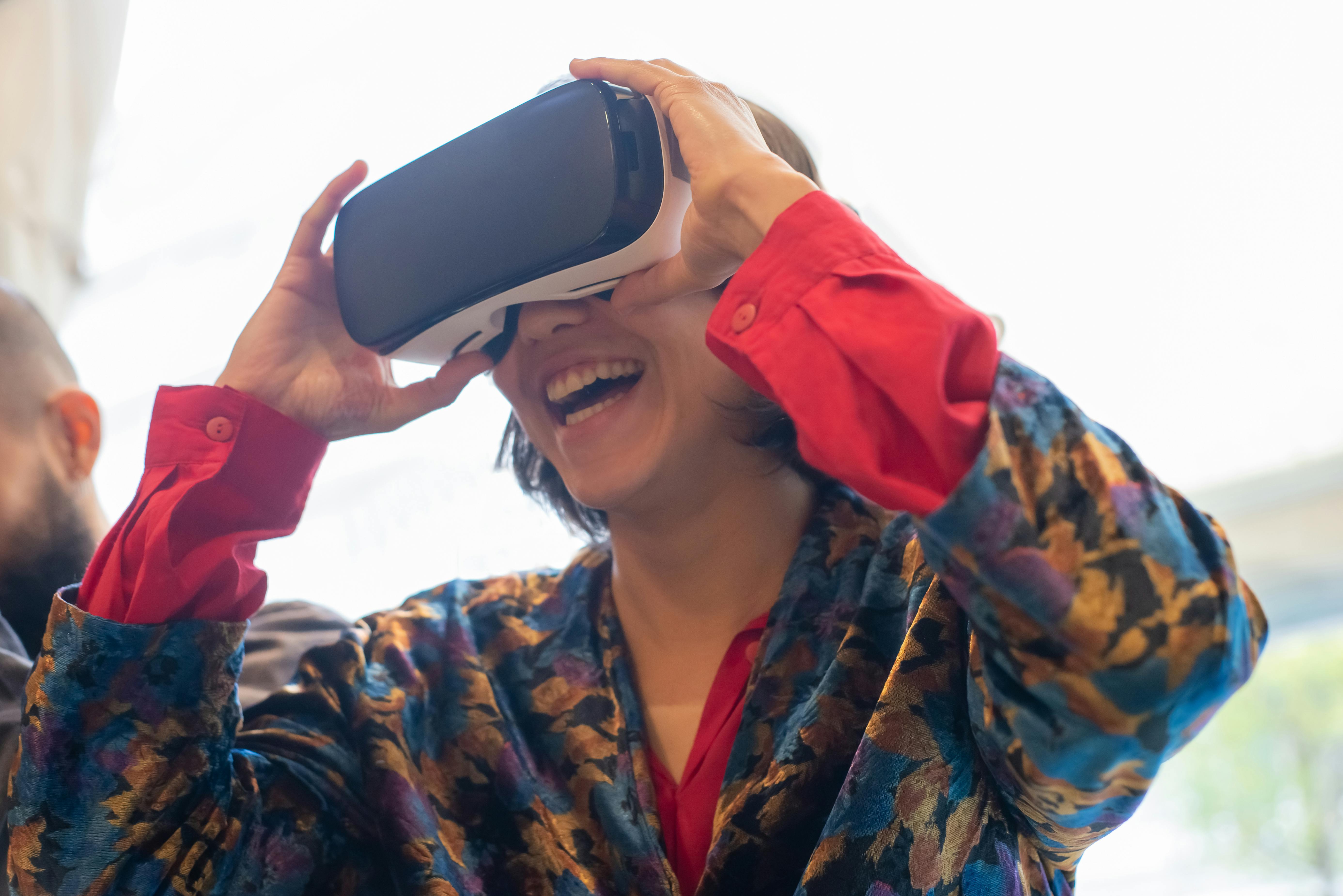 woman holding a virtual reality headset