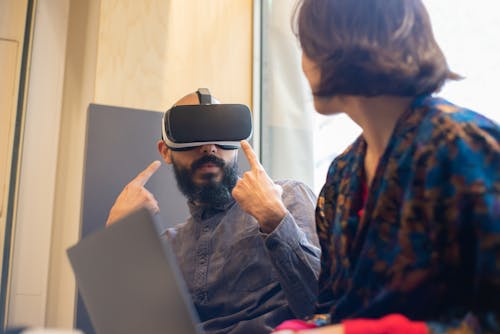 A Man Showing His VR Goggles