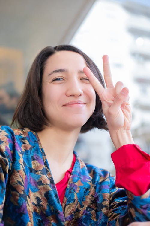Woman Doing a Peace Sign