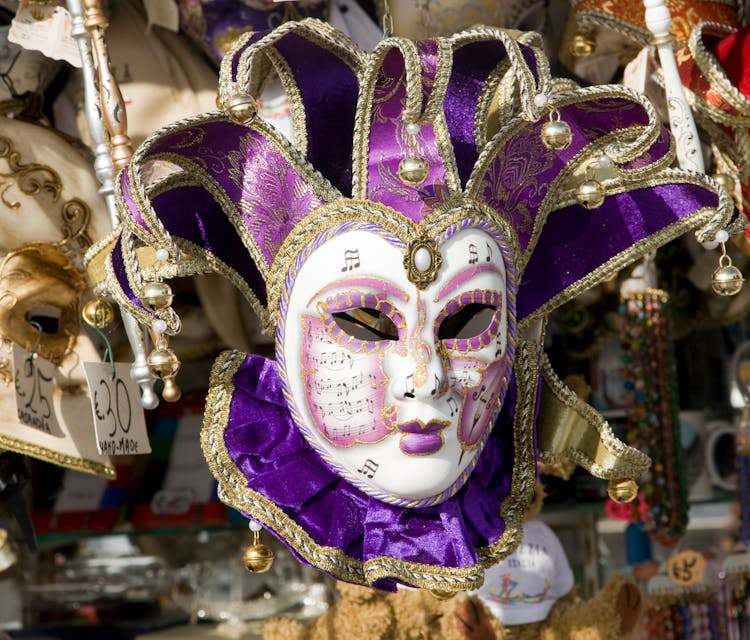 A Purple Jester Mask On Display