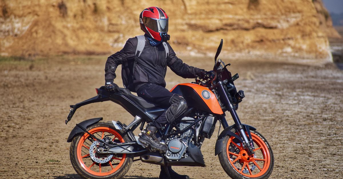Person Rider A Person Riding a Motorcycle · Free Stock Photo