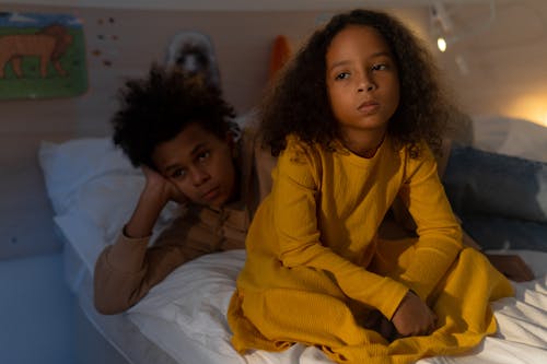 Free Brother and Sister on Bed Stock Photo