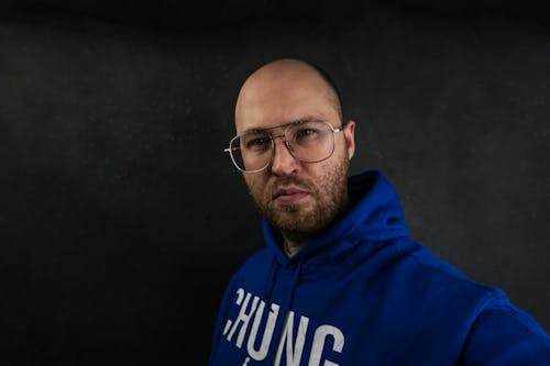 A Man Wearing a Blue Hoodie