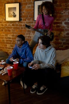Three teenagers enjoying video games and music in a cozy indoor setting.