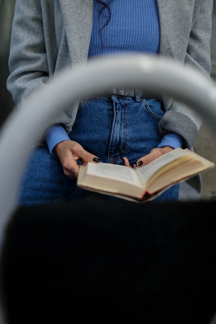 A Person Reading A Book 