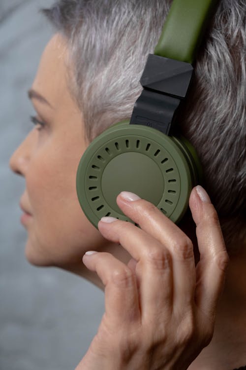 Woman Wearing a Green Headphones