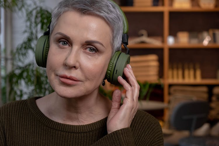 Woman Wearing Green Headset