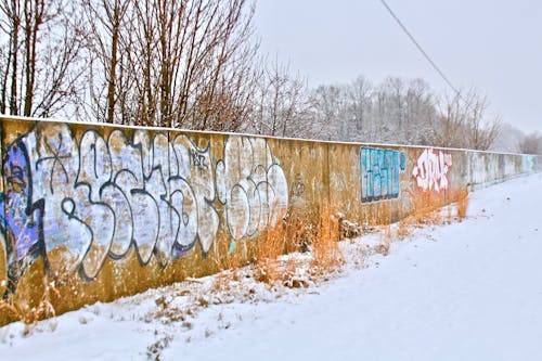 Free Wall with Graffiti in City Suburbs Stock Photo