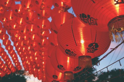 Free Bright red lanterns illuminate the sky in Bangkok, showcasing traditional Chinese decorations. Stock Photo