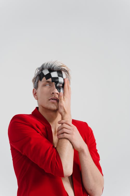 Photo of a Man Posing with His Hand on His Face