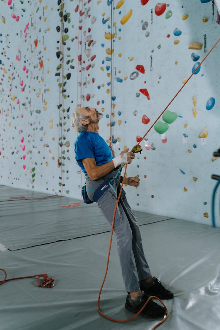 Elderly Man Wearing A Climbing Harness